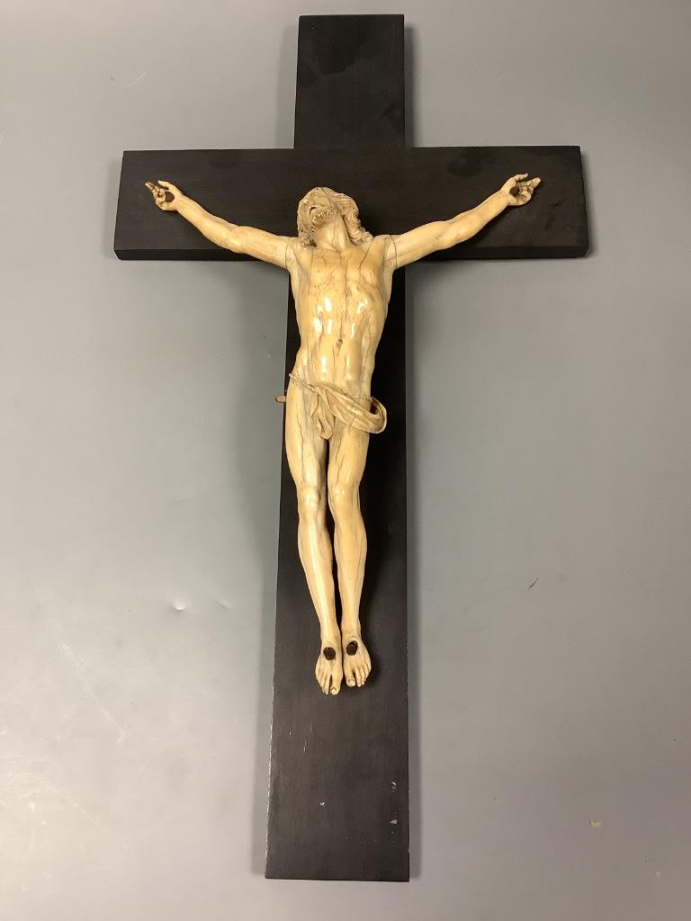 A 19th century Dieppe carved ivory and ebony crucifix, overall length 48cm